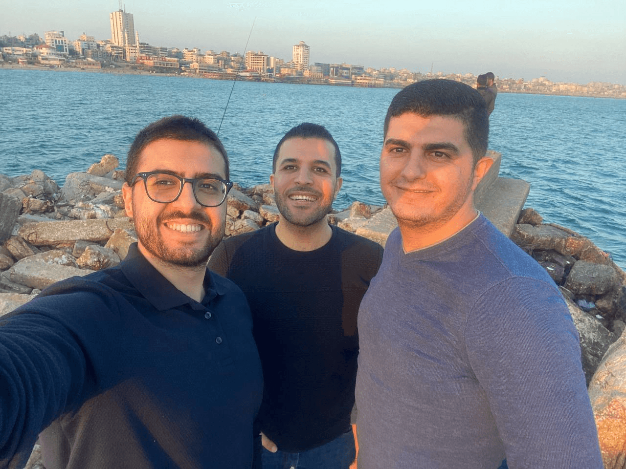 At the sea after the old city day: Nael, Maisara, and Bahzad.